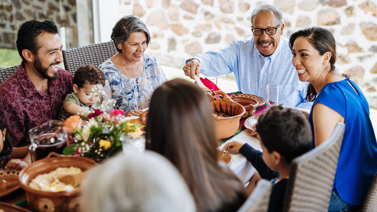 Happy family having meal together